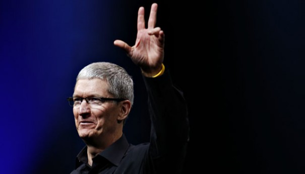 Apple CEO Tim Cook waves at the end of Apple Inc.'s iPhone media event in San Francisco