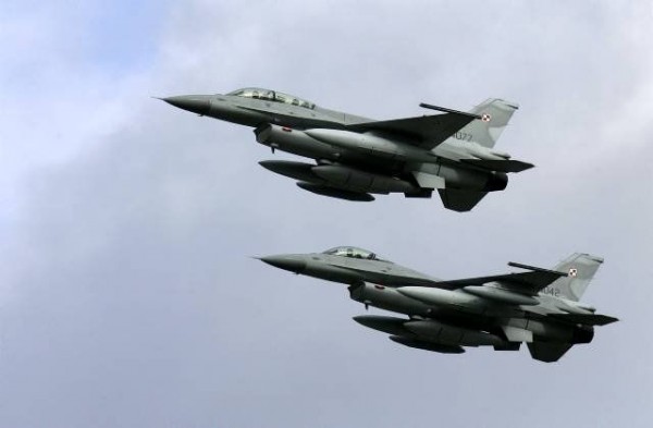 Two of the first four Polish Air Force F-16 fighter jets arrive at the Krzesiny airport in western Poland