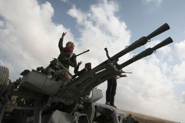 Libyan rebels celebrate near the strateg
